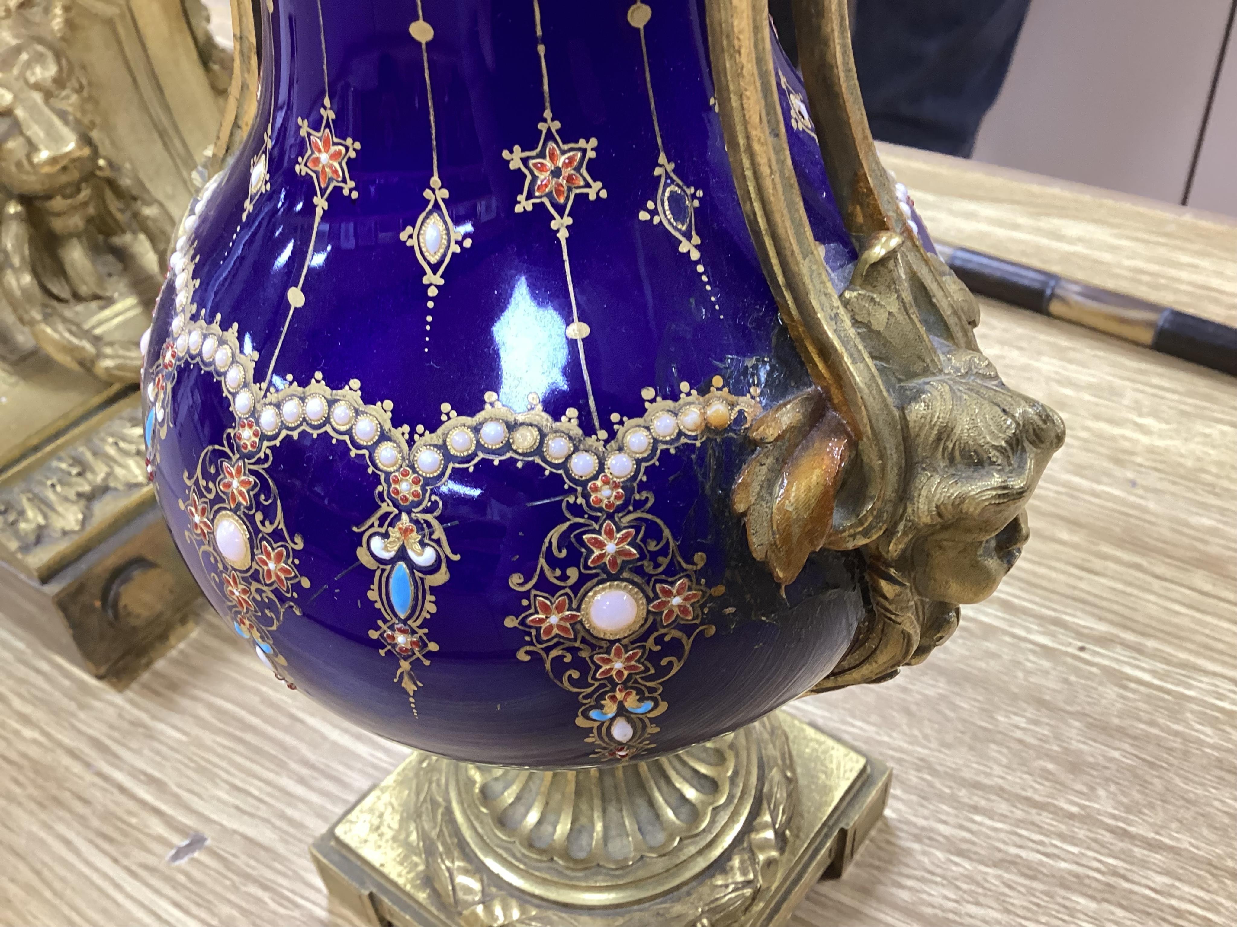 A 19th century Sevres style jewelled porcelain and ormolu matched clock garniture, striking on a bell, with pendulum, 51cm high. Condition - fair to good, minor restoration, untested